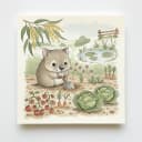 Baby wombat digging in a backyard veggie patch.